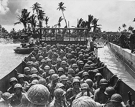 VIEW OF AMERICAN SOLDIERS ABOARD A LANDING CRAFT ON KWAJALEIN ATOLL IN FEBRUARY 1944
